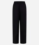 Pantalón femenino de corte fluido, color beige claro, con cintura elástica ajustable mediante un lazo.