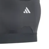 Top deportivo negro con espalda cruzada, diseñado para proporcionar libertad de movimiento y soporte flexible durante el entrenamiento.