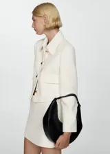 Minifalda color crudo de tejido mezcla de algodón con forro interior y cierre lateral de cremallera.