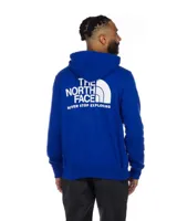 Buzo canguro azul con capucha y cordones ajustables. Logotipo de The North Face estampado en blanco en el pecho.