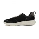 Zapatillas grises con detalles en lila, cordones elásticos y suela blanca.