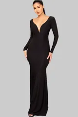 Vestido largo de fiesta negro con escote en V profundo y mangas largas. Confeccionado en tejido stretch ity con brillo.