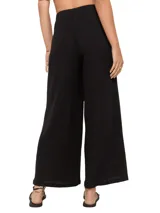 Pantalón negro de tejido acanalado, corte ancho y cintura elástica.