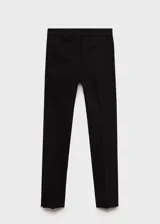 Remera negra con brillo, de tejido de punto fino y manga larga.