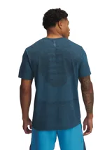 Remera deportiva gris jaspeado de corte clásico, con cuello redondo y mangas cortas. Confeccionada con tejido de punto transpirable y tecnología seamless para mayor comodidad.