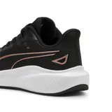 Championes Puma Skyrocket Lite de mujer, color negro con logo en color cobre y suela blanca.