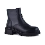Bota casual de cuero negro con cierre lateral, diseño de taco bajo y suela antideslizante.