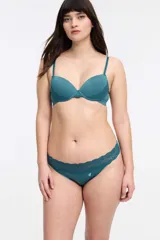 Colaless color verde esmeralda con cintura de encaje floral y logo bordado en blanco.