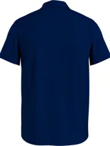 Chomba azul marino de felpa con cuello clásico, corte amplio y logo de Tommy Hilfiger bordado en el pecho.