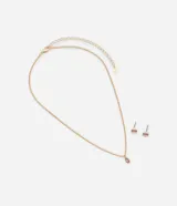 Conjunto de collar corto dorado con dije de gota rosa y caravanas rectangulares con cristal rosa.