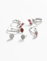 Set de tres pares de caravanas con diseño de cerezas y detalles en vidrio color rosa.