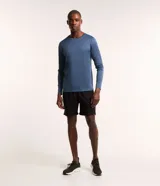 Remera deportiva azul para hombre, modelo comfort, confeccionada en tejido de poliéster con tecnología Dry, cuello redondo y mangas largas.