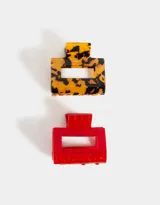 Set de dos broches para el pelo de resina: uno con estampado carey y otro rojo.