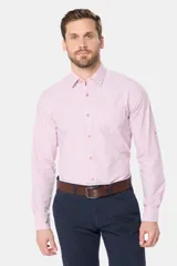 Camisa celeste a rayas verticales, de manga larga con opción de enrollar, corte slim fit, con bolsillo en el pecho y confeccionada en algodón.