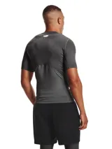 Remera deportiva blanca Under Armour HeatGear Armour de manga corta, corte ajustado y logo negro en el pecho.