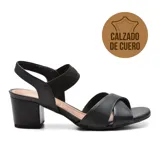 Sandalias de cuero negro con taco bloque, tiras cruzadas en el empeine y pulsera elástica en el tobillo.