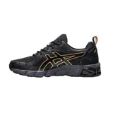 Championes Asics Gel-Quantum 180 negros con detalles dorados.