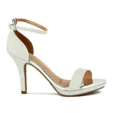 Sandalia de tacón alto Vizzano, color rosado brillante, con tira fina en el tobillo y tira ancha sobre los dedos. La plataforma y el tacón son de acabado metálico rosado.