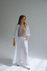 Pantalón palazzo blanco de lino italiano, con cintura elastizada.