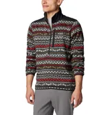 Buzo polar Columbia con cuello alto y cierre de media cremallera. Diseño con estampado geométrico en tonos grises y bolsillo con cremallera en el pecho.