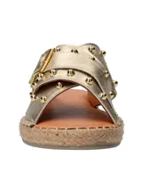 Sandalias negras de cuero con tiras cruzadas y hebilla dorada.