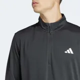 Camiseta deportiva Adidas de manga larga, color gris oscuro, con cierre de cremallera corto en el cuello y logo blanco estampado en el pecho. Confeccionada con tejido transpirable AEROREADY.