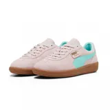 Championes Puma Palermo negros con detalles en blanco y suela color caramelo.