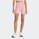 Calza corta deportiva de tiro alto, color rosa claro, ajustada al cuerpo y confeccionada con tejido suave y elástico con tecnología de secado rápido NB DRY. Presenta un pequeño logo Flying NB reflectante mate en la pierna.