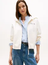 Buzo con capucha y cierre frontal de Tommy Hilfiger, color blanco hueso, con logo bordado en el pecho.