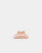Broche para el pelo color rosa claro, con forma de pinza y diseño de moño.