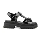 Sandalias negras de charol con hebillas plateadas y plataforma track.