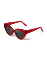 Gafas de sol con forma de ojo de gato, montura de acetato biodegradable color verde y lentes de PMMA reciclado color negro.