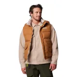 Chaleco reversible Columbia color marrón con relleno de plumón. Tiene cierre frontal con solapa, bolsillos con cremallera y dobladillo ajustable con cordón. El tejido Omni-Shield™ repele la humedad y resiste las manchas.