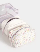 Neceser transparente con estampado floral, con manija superior y doble cierre.
