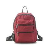 Mochila color beige de tafeta con apertura superior con cierre y tiradores metálicos. Incluye bolsillos internos, bolsillo con doble cierre metálico al frente, asas rígidas de mano y correas regulables para colgar en la espalda.