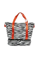 Bolso tipo tote con estampado de cebra en blanco y negro, con doble compartimento y asas de color naranja.