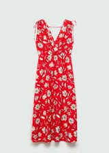 Vestido midi blanco con estampado floral verde, escote en V, tirantes finos con lazos y cintura elastizada.