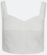 Blusa cropped blanca de lino con escote en V y tirantes trenzados.