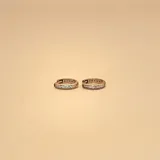Aros tipo argolla de oro amarillo 9k con circonias engarzadas.