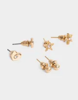 Set de tres pares de aros dorados con pasantes: un par con forma de estrella con strass, un par con forma de corazón con strass y un par de bolitas de metal.