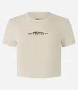Blusa new t-shirt de manga corta color beige, confeccionada en algodón bci, con cuello redondo y estampado frontal con la frase "Self Love, But I Text My Ex".