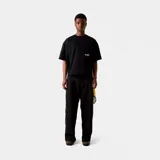 Remera negra de corte cuadrado con logo de la marca Eme Studios y texto "Always grateful for my roots, crafted with care 5135, veteran collection" estampado en blanco en la espalda.