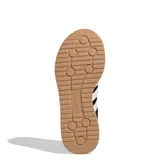 Championes Adidas Run 72S 2.0, color negro con tres franjas laterales blancas y detalles en blanco en el talón y lengüeta. Cuentan con entresuela blanca y suela de goma color caramelo.