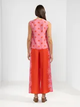 Musculosa de viscosa y poliamida con estampado de flores, con lazos en los costados.