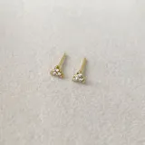Caravana minimalista en plata 925 con baño de oro de 14k y zirconias, en forma de flor.