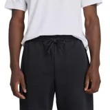 Pantalón de jogging negro de felpa francesa con cintura y tobillos elastizados, cordón de ajuste externo, bolsillos laterales y trasero. Logo bordado de New Balance en el muslo izquierdo.