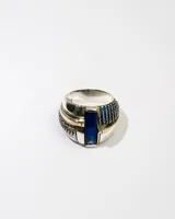 Anillo de plata 925 con dublé de oro y zirconias azules.