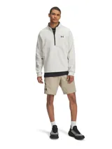 Short deportivo Under Armour Unstoppable para hombre, color beige, con logo negro en la pierna izquierda y cierre lateral en negro.