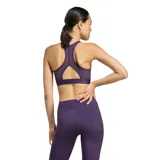 Top deportivo Adidas de color violeta con el logotipo de la marca en grande en el frente en color negro. Presenta un diseño de espalda deportiva con panel de malla para mayor transpirabilidad y una banda elástica en la base para soporte.