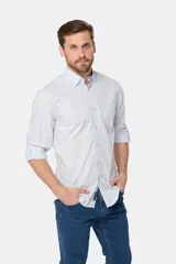 Camisa azul marino de manga larga con bolsillo en el pecho, confeccionada en algodón.